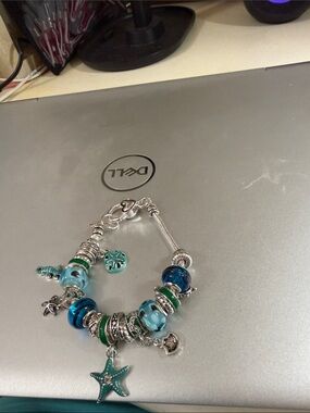 Beautiful coastal blue sea charm bracelet 8”
Like Pandora.